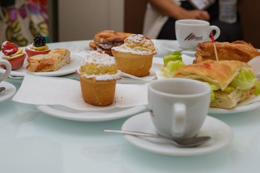 Lucca: Morning Food Tour with Snacks and Coffee - Amphitheatre Square: Roman bones under medieval Lucca